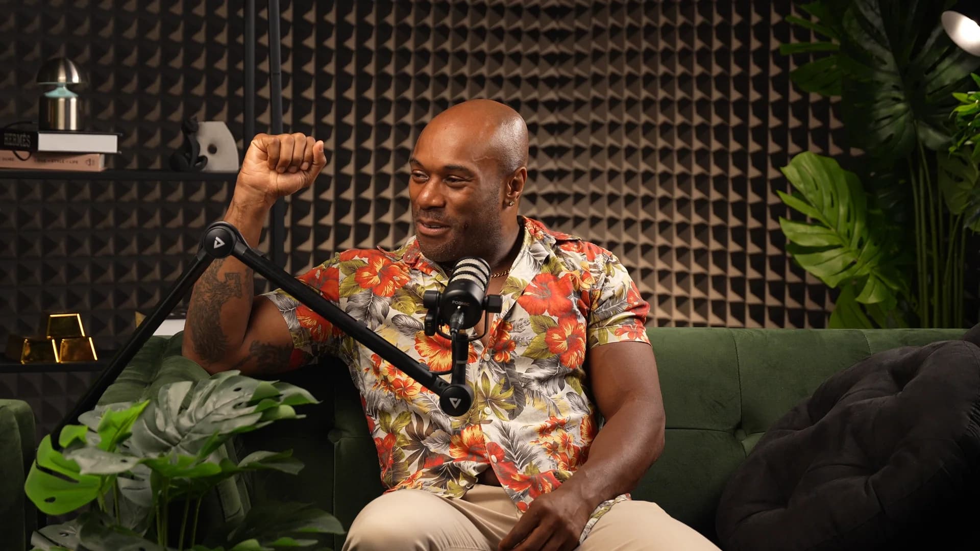 Podcast guest on a green sofa