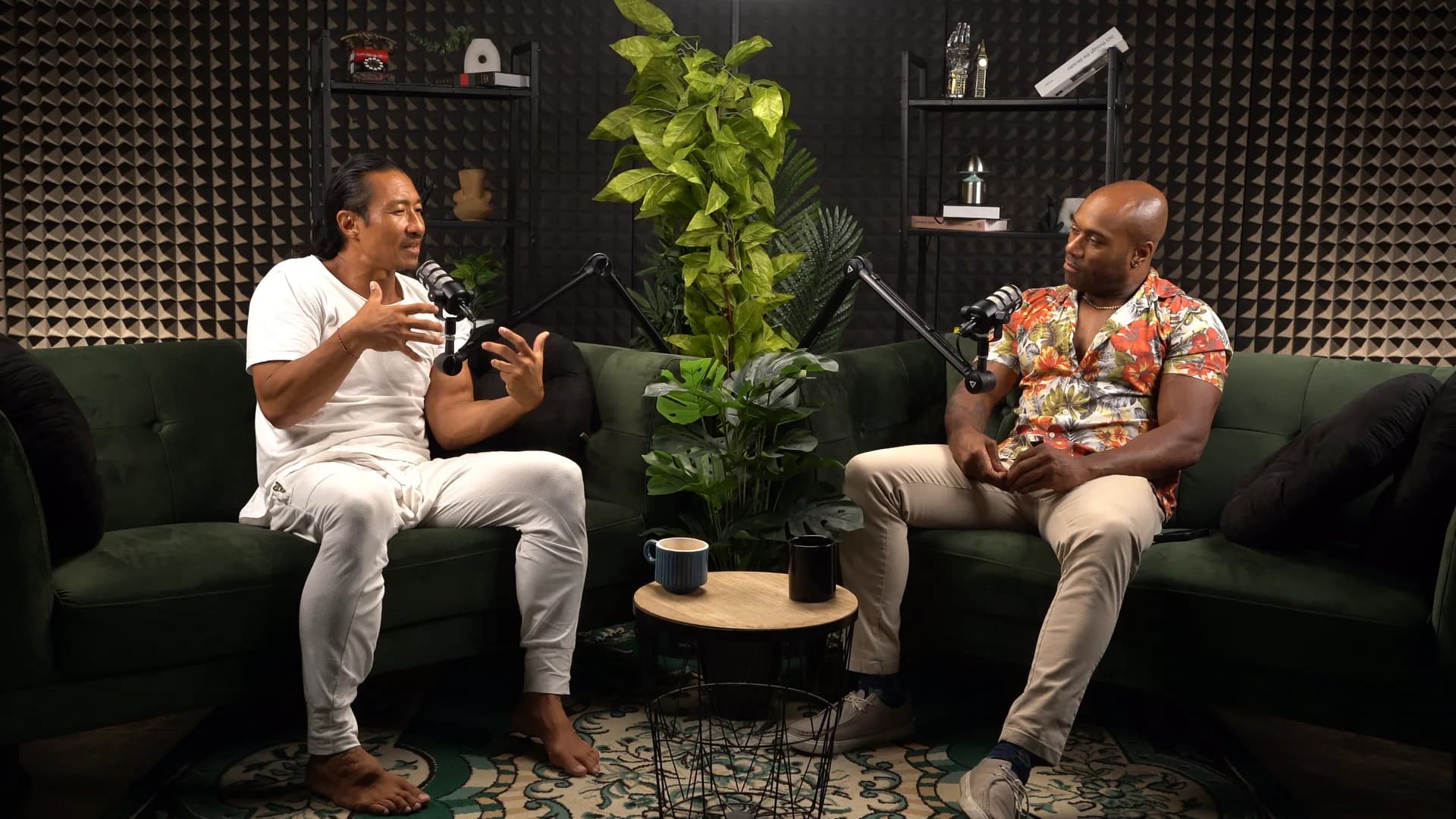 Two-person podcast on green sofas