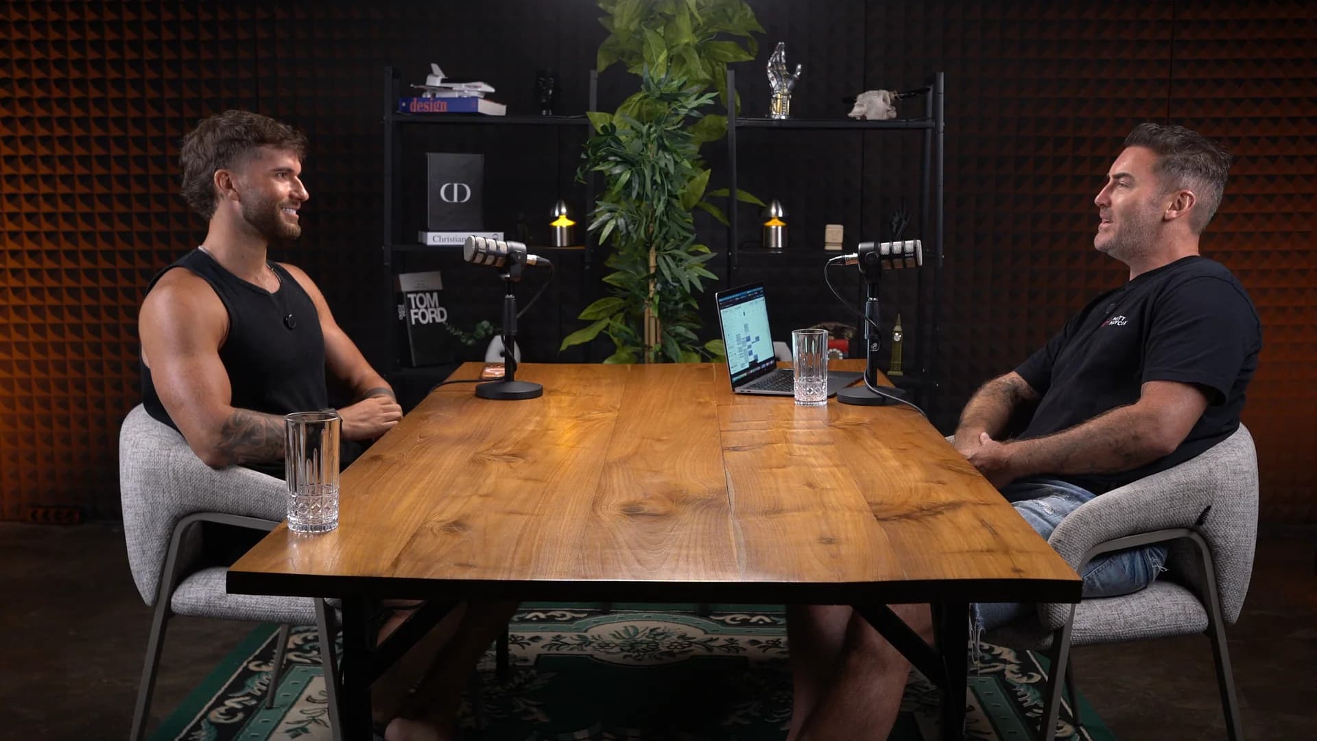 Two-person podcast across a wooden table