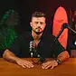 Bright lively podcast studio with vibrant red and green lighting at Villo Studio.