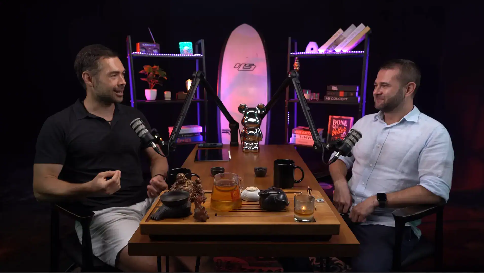 Modern podcast studio with two hosts, microphones, and vibrant decor for engaging content creation.