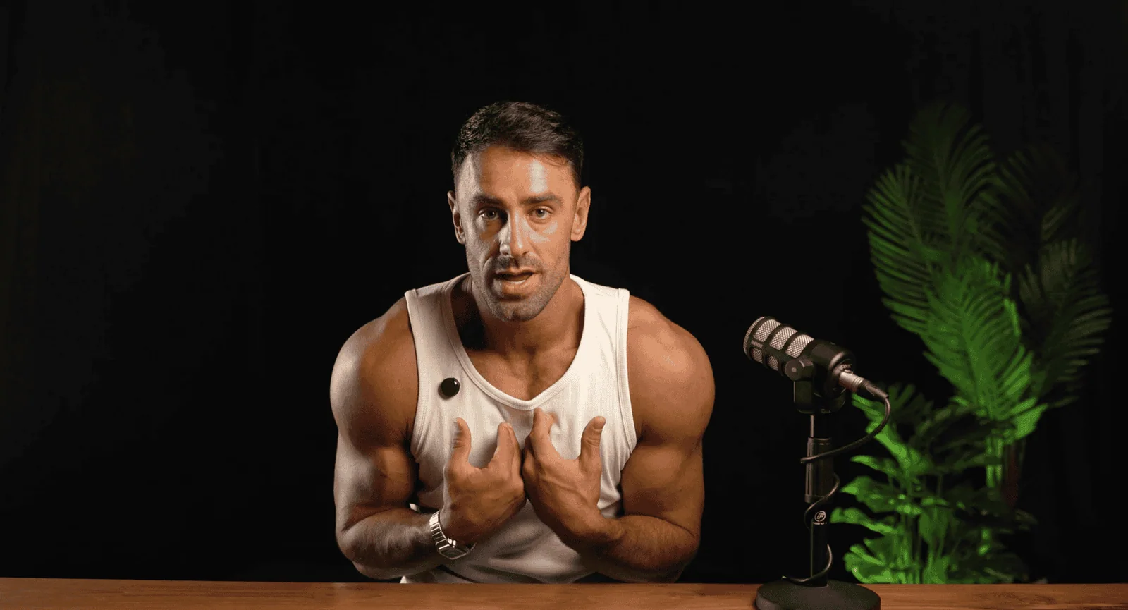 Villo Studio professional podcast or video recording setup with a dynamic speaker in front of black background.