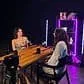 Vibrant Villo Studio setup with LED lighting and music, perfect for creative and social events.