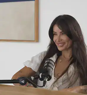 Professional woman podcasting with microphone in studio, Villo Studio South Africa.