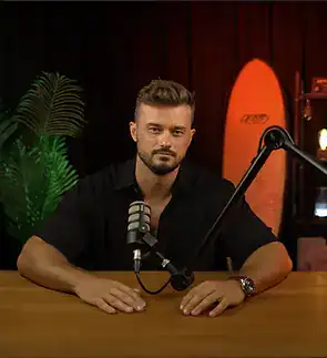 Professional male podcast host at Villo Studio in South Africa, recording in a modern studio environment.